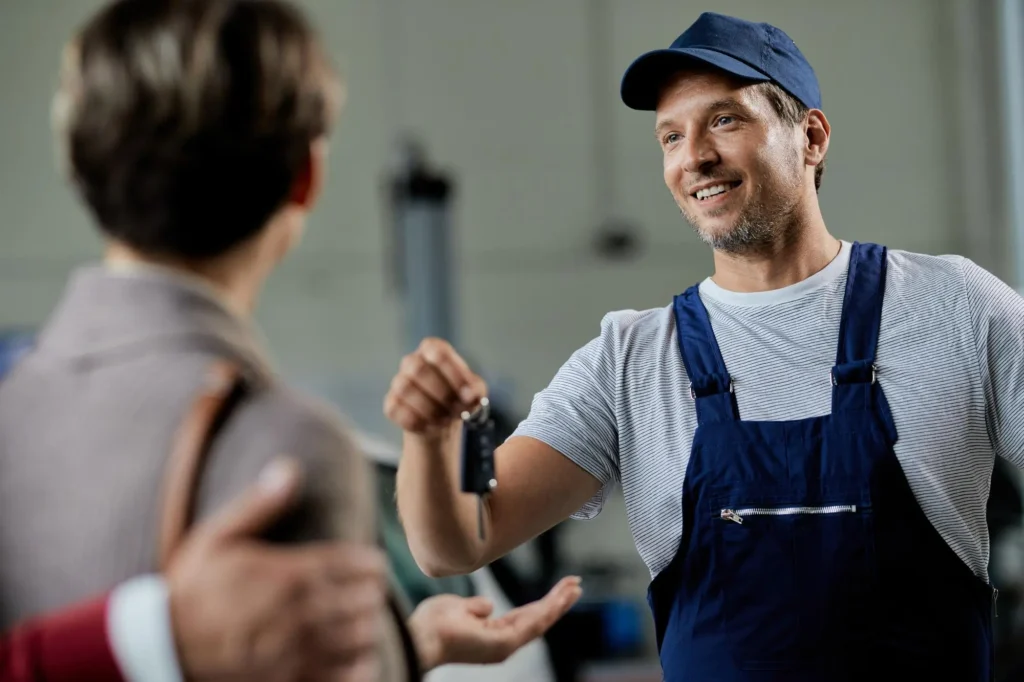 Mobile Locksmith Chicago, gives keys to happy customer.